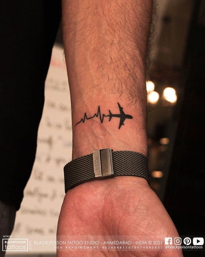 hand tattoos for men - aeroplane tattoo - The Dashing Man