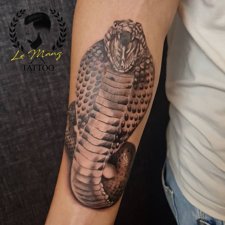 hand tattoos for men - snake tattoo - The Dashing Man