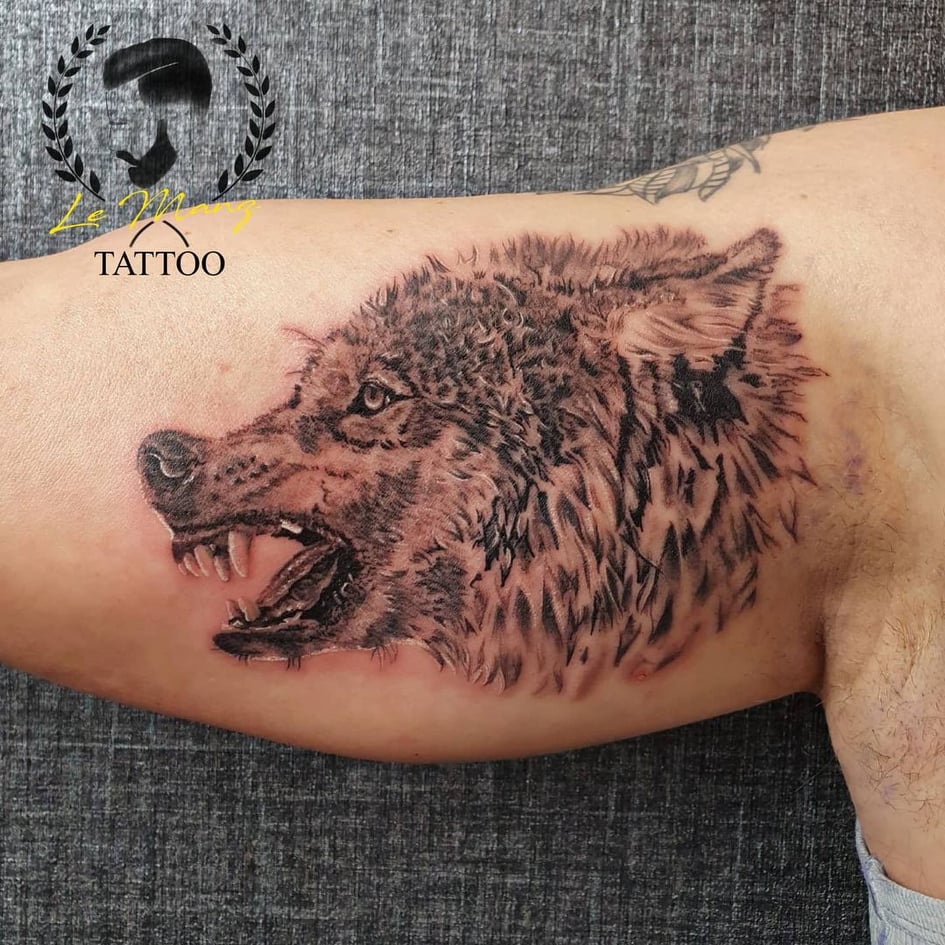 hand tattoos for men - wolf tattoo - The Dashing Man